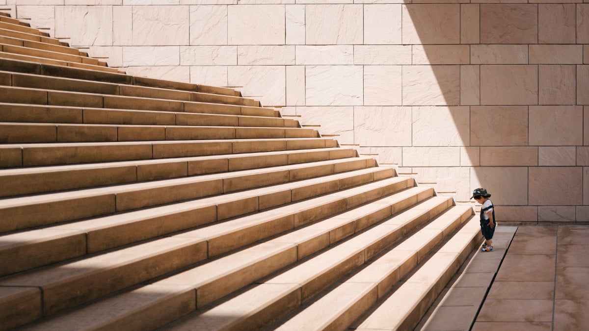 persevering in front of large steps