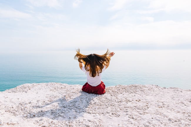 Happy and relaxed woman on a shore